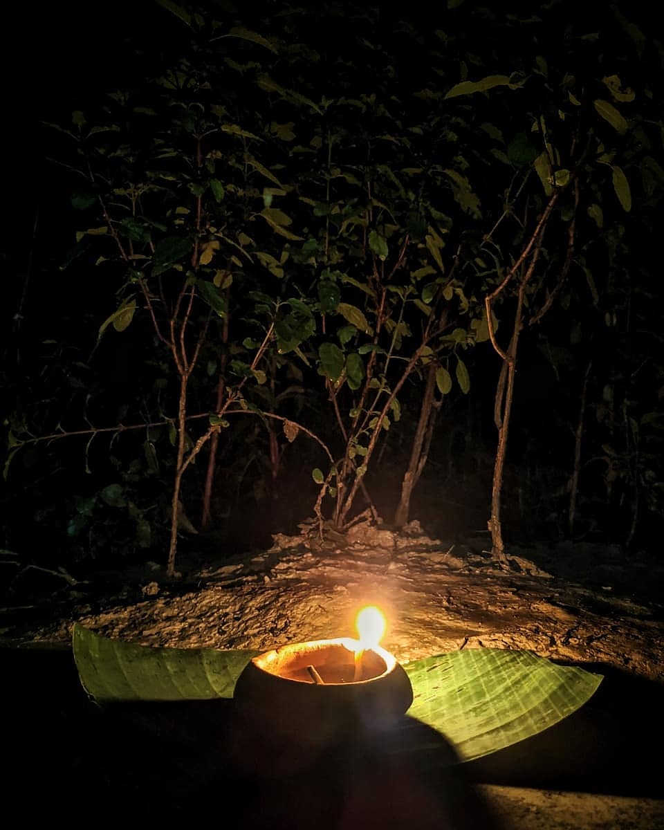 Earthen lamp near tulsi plant on Kati Bihu